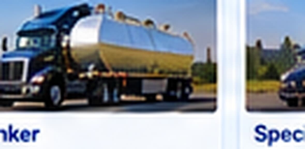 Polished tanker trailer behind a dark tractor